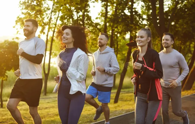 group-runners-jogging-together-smiles-summer-park-morning-outdoor-cardio-workout-marathon-race-happy-fit-418302154